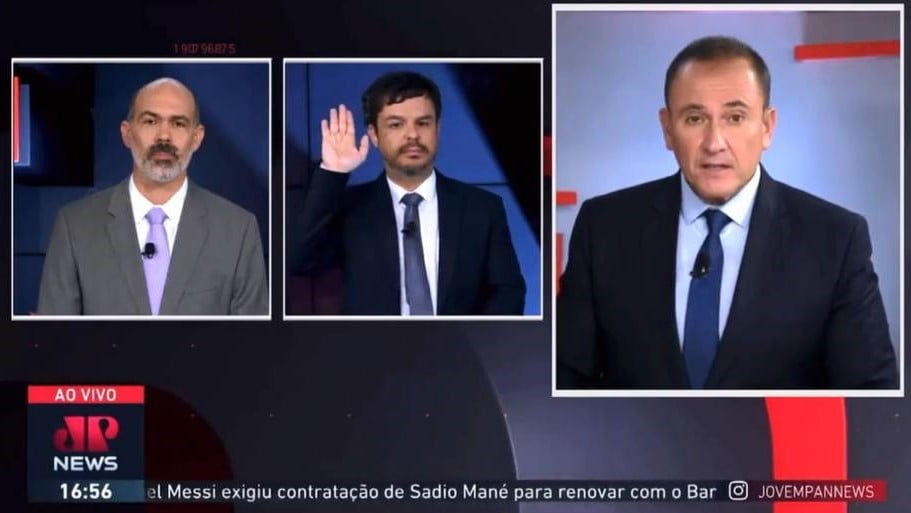 Adrilles Jorge fez um gesto com a mão direita associado com a saudação nazista em um debate na Jovem Pan News (Foto: Reprodução/YouTube)