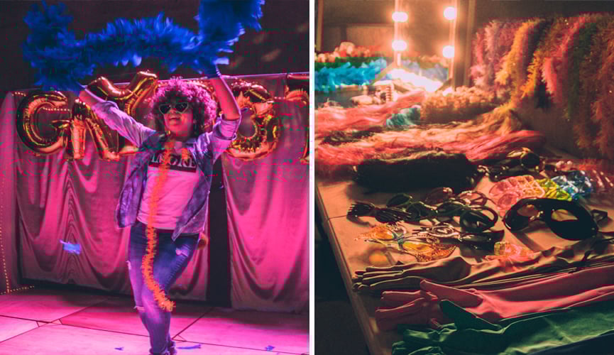 À esquerda, mulher com peruca e plumas dança em frente a cenário montado; à direita, uma série de adereços em cima da mesa que fazem parte da intervenção