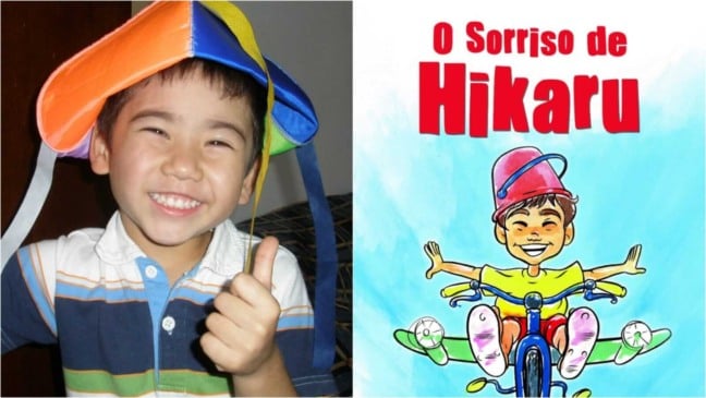 Menino ao lado de capa de livro