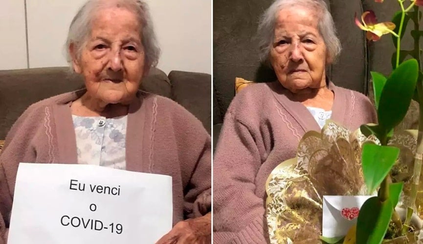 Foto de idosa com placa da vitória