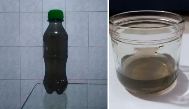 Moradores de SP coletam água escura de chuva ontem