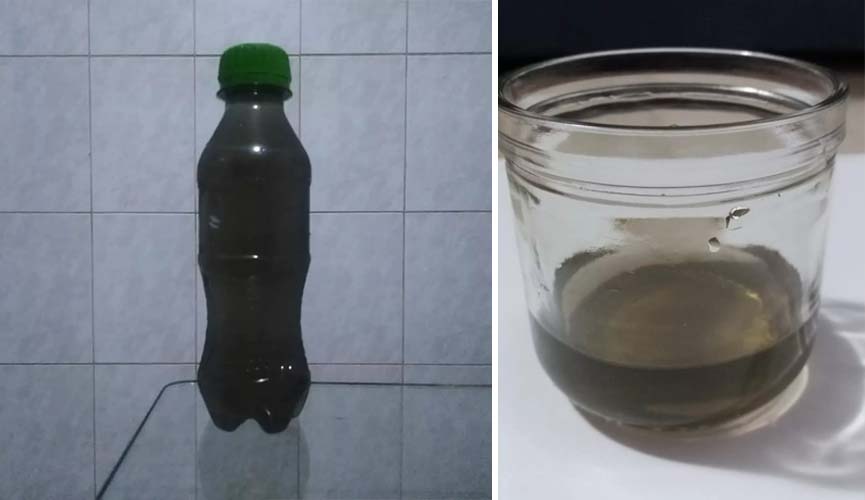 Moradores de SP coletam água escura de chuva ontem Moradores de SP coletam água escura de chuva ontem