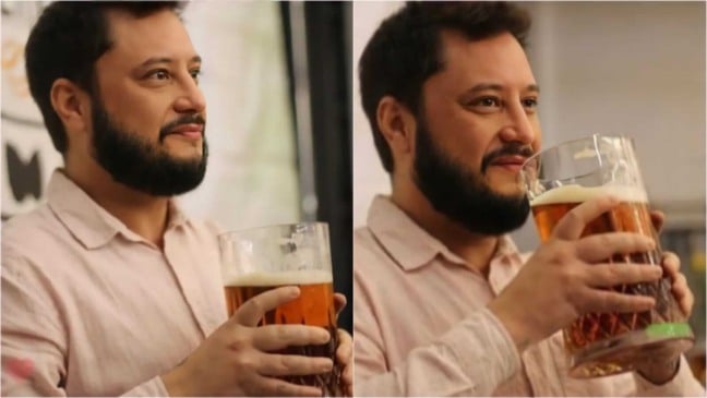Homem com copo de cerveja