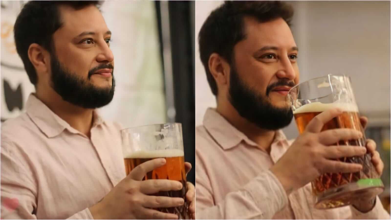 Homem com copo de cerveja