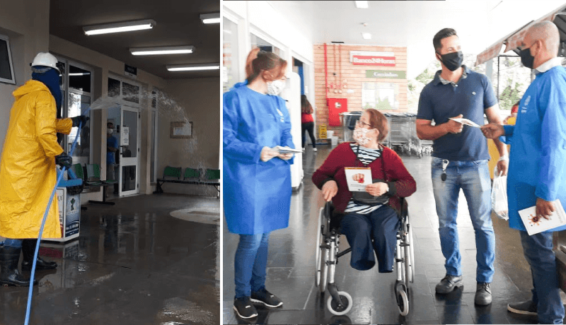 Funcionário faz desinfecção de rua, enquanto equipes entregam folhetos e máscaras