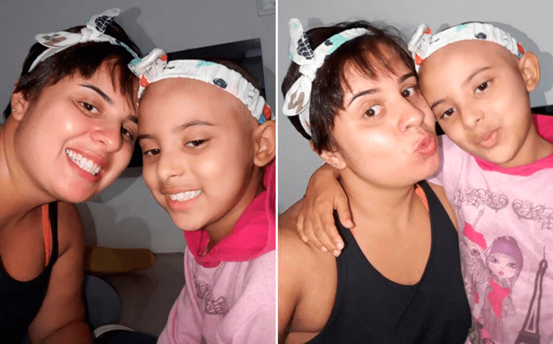 Sue Ellen, com cabelo bem curtinho, e Maria Gabriela com a cabeça raspada