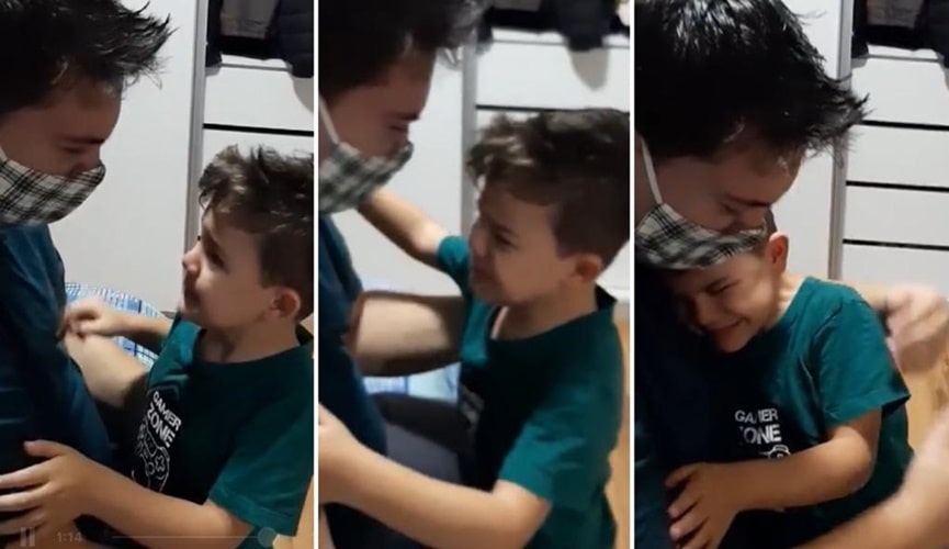 Foto de pai e filho se abraçando
