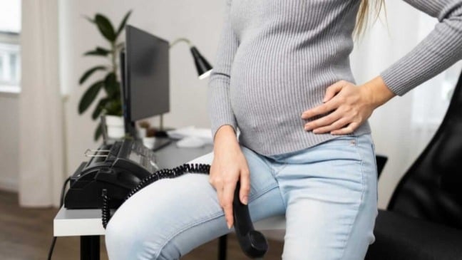 Mulher grávida no trabalho