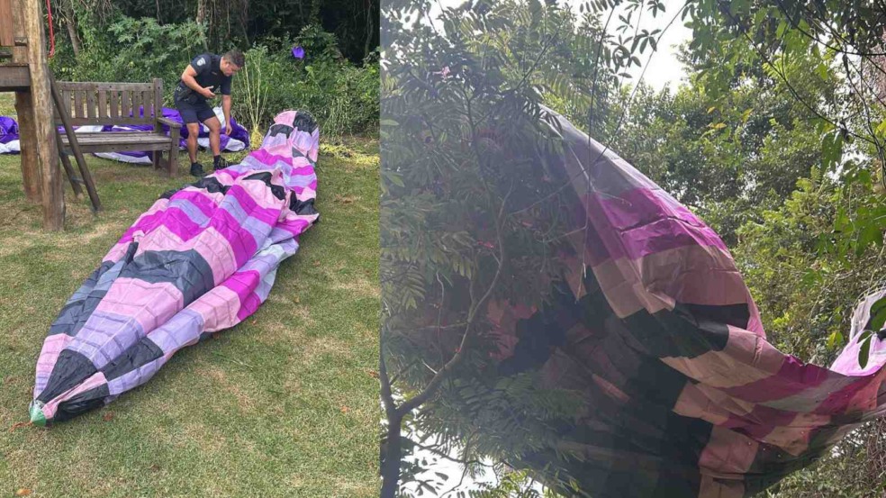 À esquerda, guarda recolhendo balão; à direita, balão enroscado nas árvores.