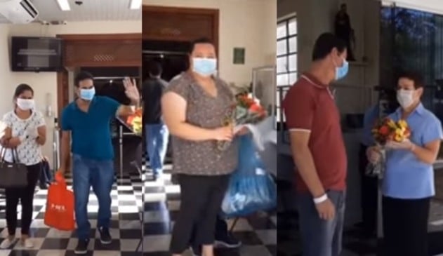 Foto de pacientes deixando o hospital, com flores e carinho de profissionais do HSV