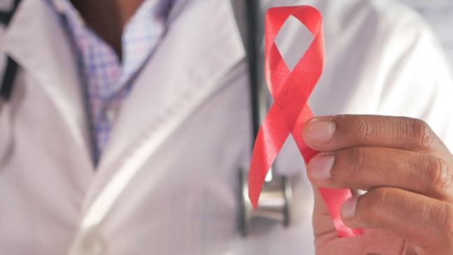 Laço vermelho, símbolo da Campanha Dezembro Vermelho.