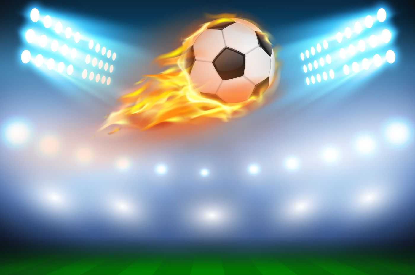 A imagem mostra uma bola de futebol em chamas voando em um campo iluminado por holofotes, representando emoção e ação, comum em temas de caça-níqueis com temática esportiva.