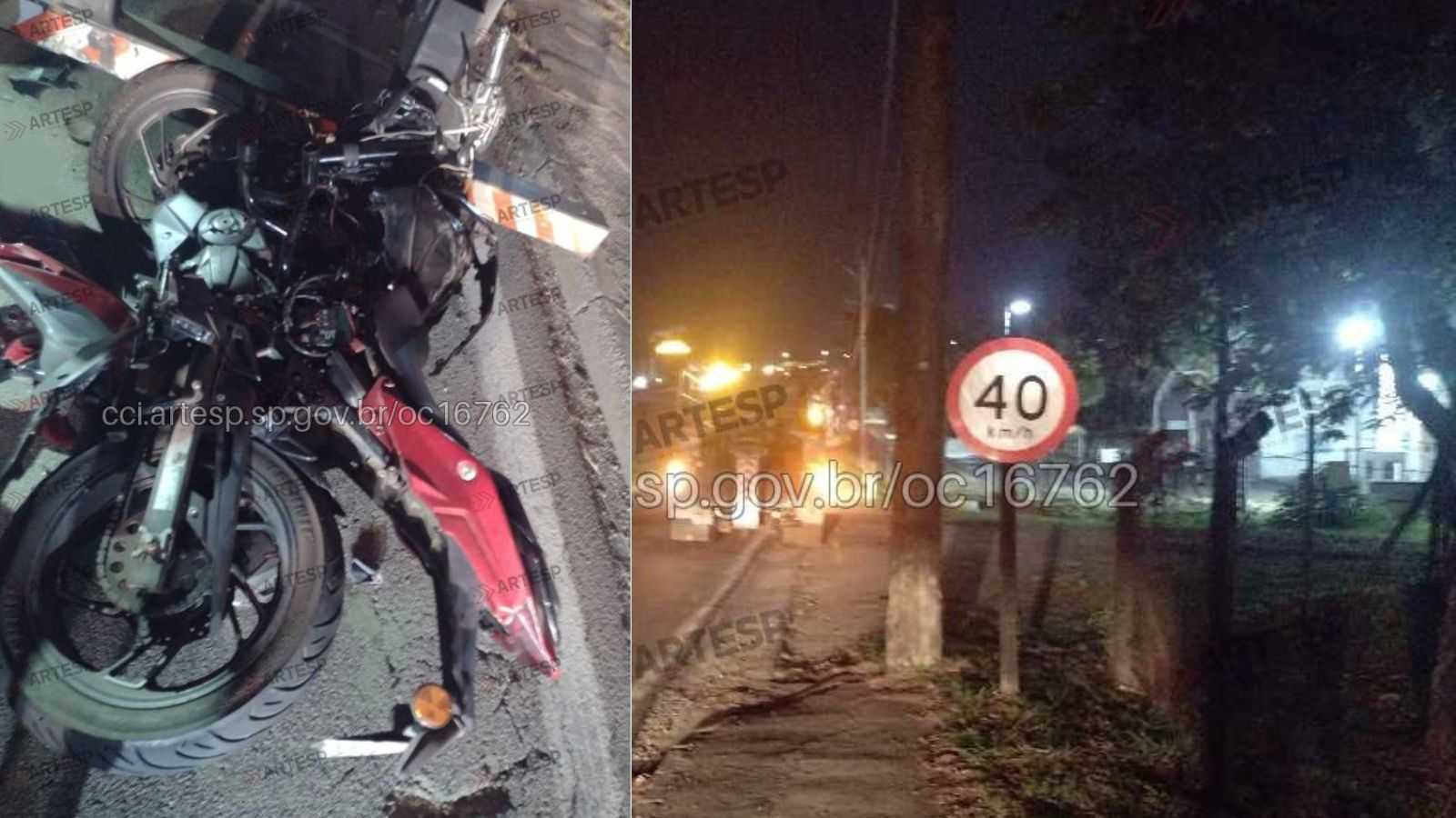 Motocicleta vermelha destruída após colisão com carreta parada na Rodovia Dom Gabriel, em Jundiaí, com sinalização de 40 km/h e equipes atuando no local durante a madrugada.