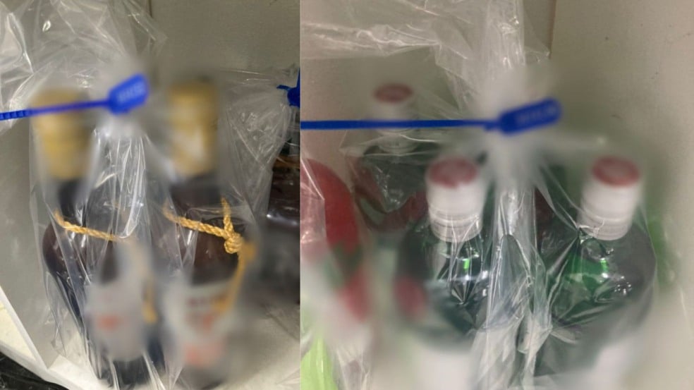 Garrafas de bebidas alcoólicas interditadas pela Vigilância Sanitária de Jundiaí lacradas em sacos plásticos. Garrafas de bebidas alcoólicas interditadas pela Vigilância Sanitária de Jundiaí lacradas em sacos plásticos.